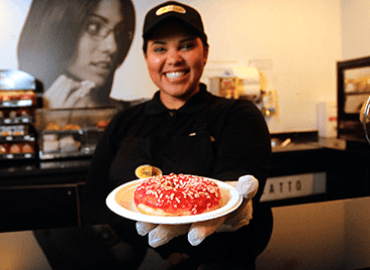 Serving a jelly donut at Compass Group Chile